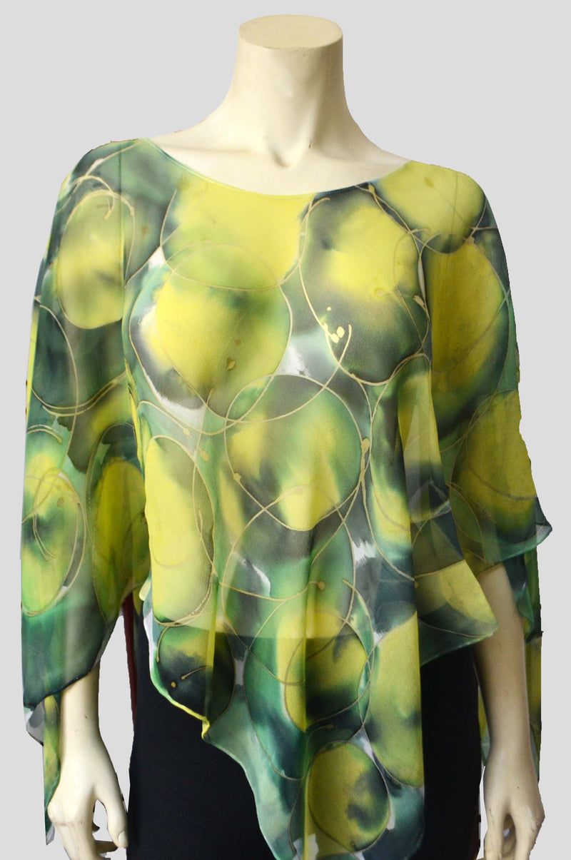 When life gives you lemons wear a Lemons Poncho. This silk chiffon poncho is perfect to wear to a summer party or traveling in summer ! It drapes well and can also be worn as a scarf. Wear it with a camisole on a summer day and feel cool yet be covered from the sun. Wear it in deep winter over a sweater or as a scarf !