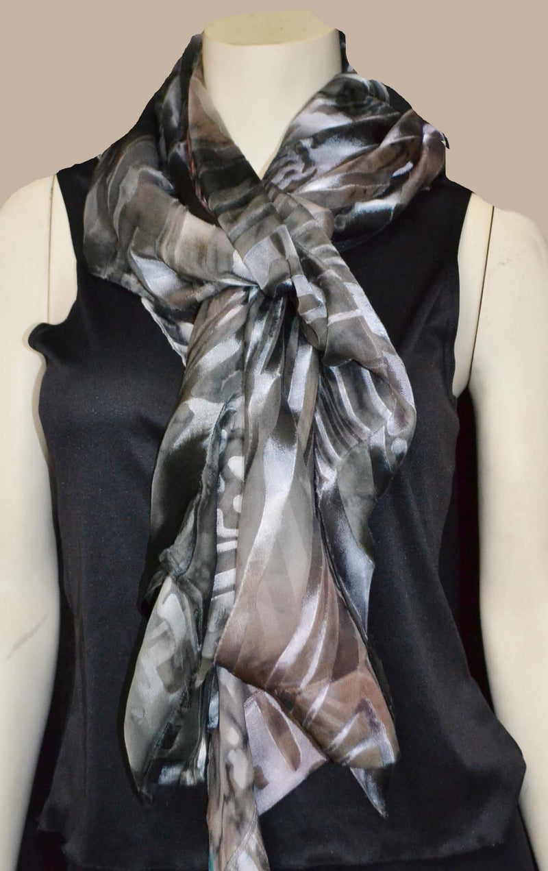The grey copper kimono jacket worn as a scarf.  Wear the jacket on your neck and guide the scarf edge though the sleeve to wear it like a scarf.