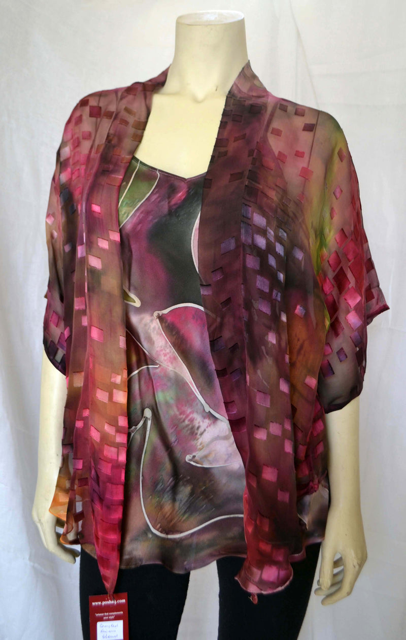 This Plum and green orange hand painted devore kimono jacket is available in sizes S-L. It can be hand washed or dry cleaned. These jackets have a scarf like edge and can be tied at the waist. You can wear it with solid sweaters, camisoles, dresses. A matching Poshaq silk camisole can be made separately once ordered. The jackets are available in sizes 1Xl-3XL.  It can also be worn as a scarf.