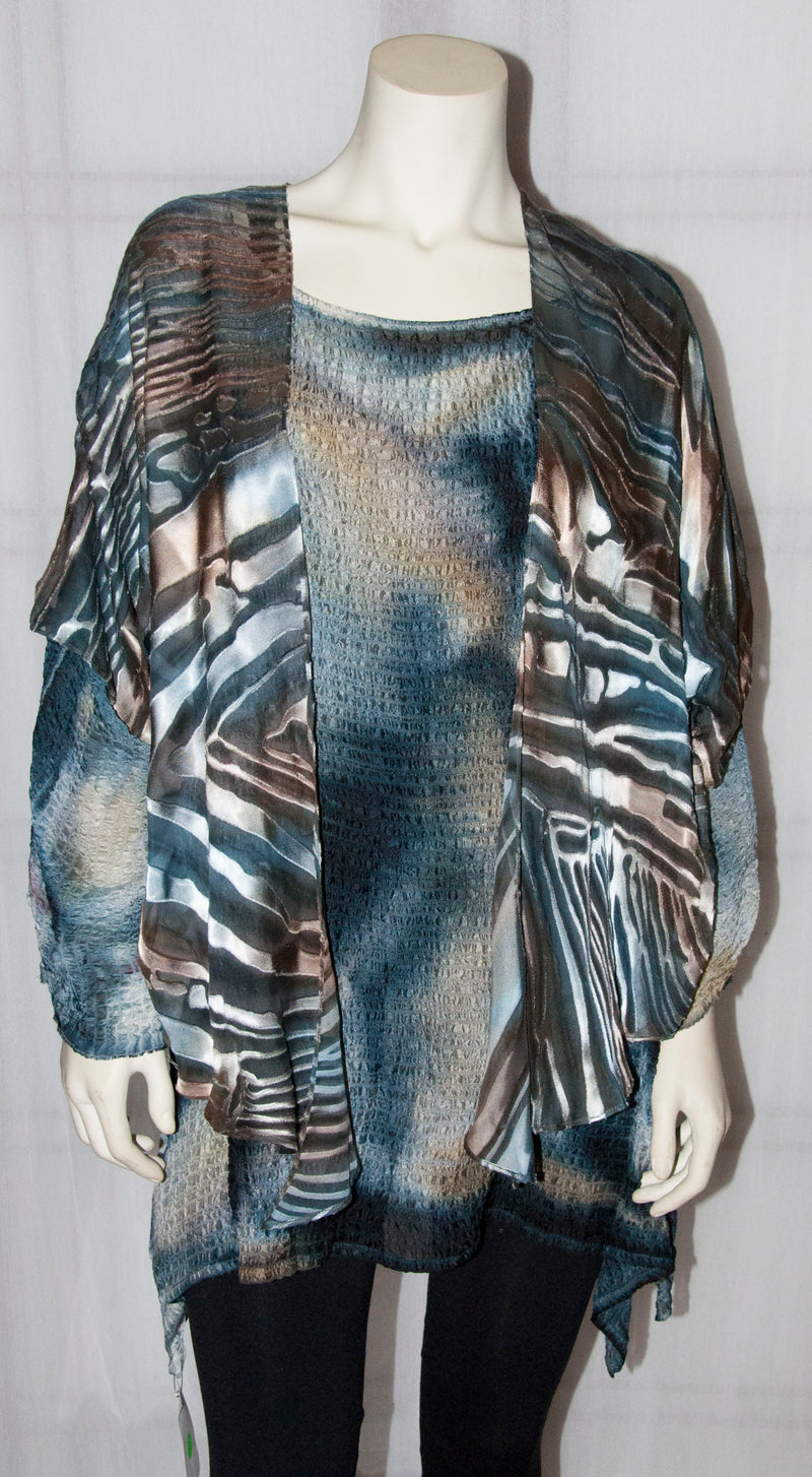This grey copper hand painted devore kimono jacket is available in sizes S-L. It can be hand washed or dry cleaned. These jackets have a scarf like edge and can be tied at the waist. You can wear  it with solid sweaters, camisoles. dresses. A matching silk camisole can be made separately once ordered. In this picture it is worn with a hand painted Poshaq silk crush tunic.