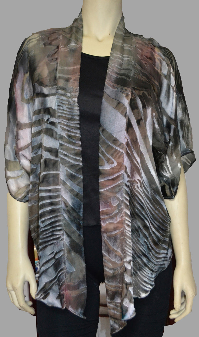This grey copper hand painted devore kimono jacket is available in sizes S-L. It can be hand washed or dry cleaned. These jackets have a scarf like edge and can be tied at the waist. You can wear it with solid sweaters, camisoles. dresses. A matching Poshaq silk camisole can be made separately once ordered.