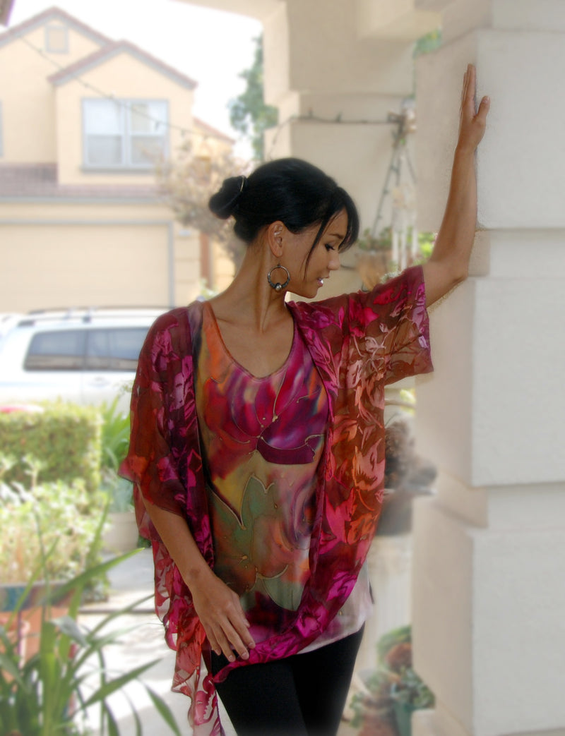 This cranberry pink orange hand painted devore kimono jacket is available in sizes S-L. It can be hand washed or dry cleaned. These jackets have a scarf like edge and can be tied at the waist. You can wear it with solid sweaters, camisoles. dresses. A matching Poshaq silk camisole can be made separately once ordered.