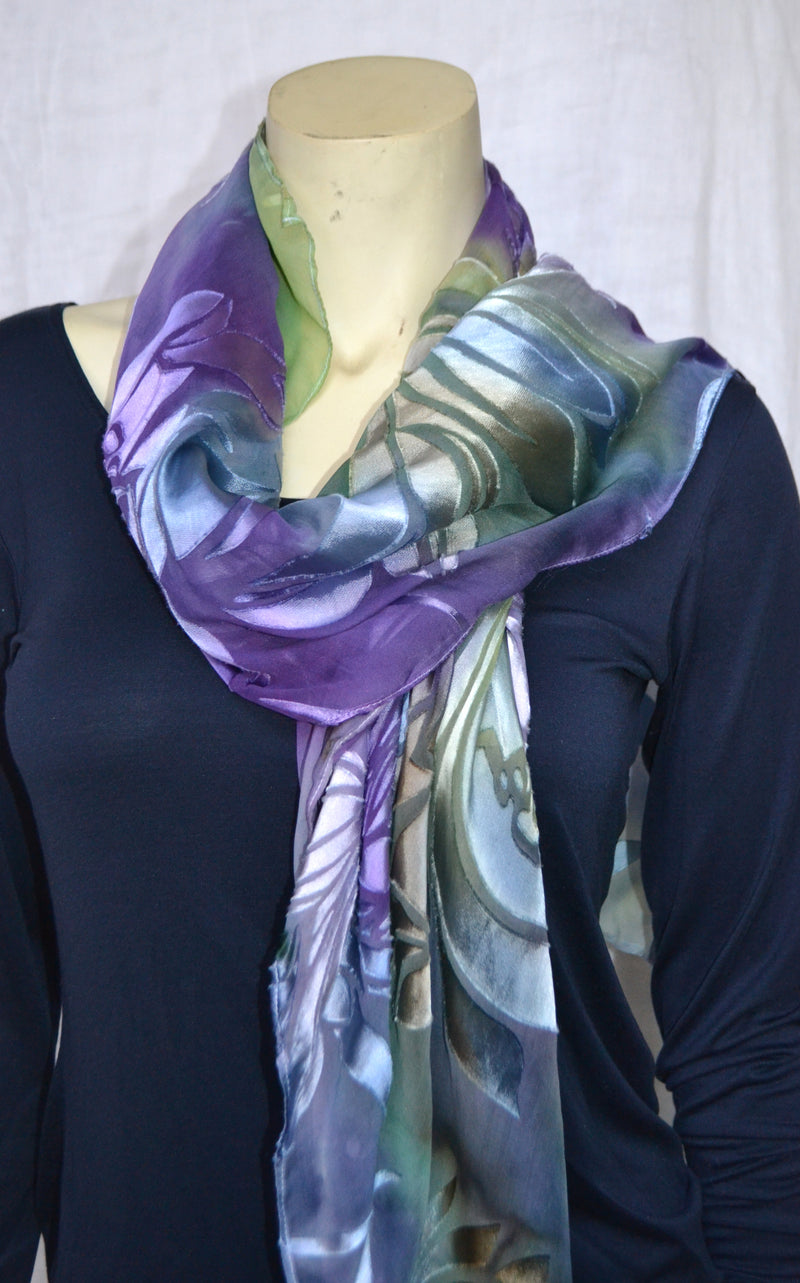Purple magnolia poncho worn as a scarf.