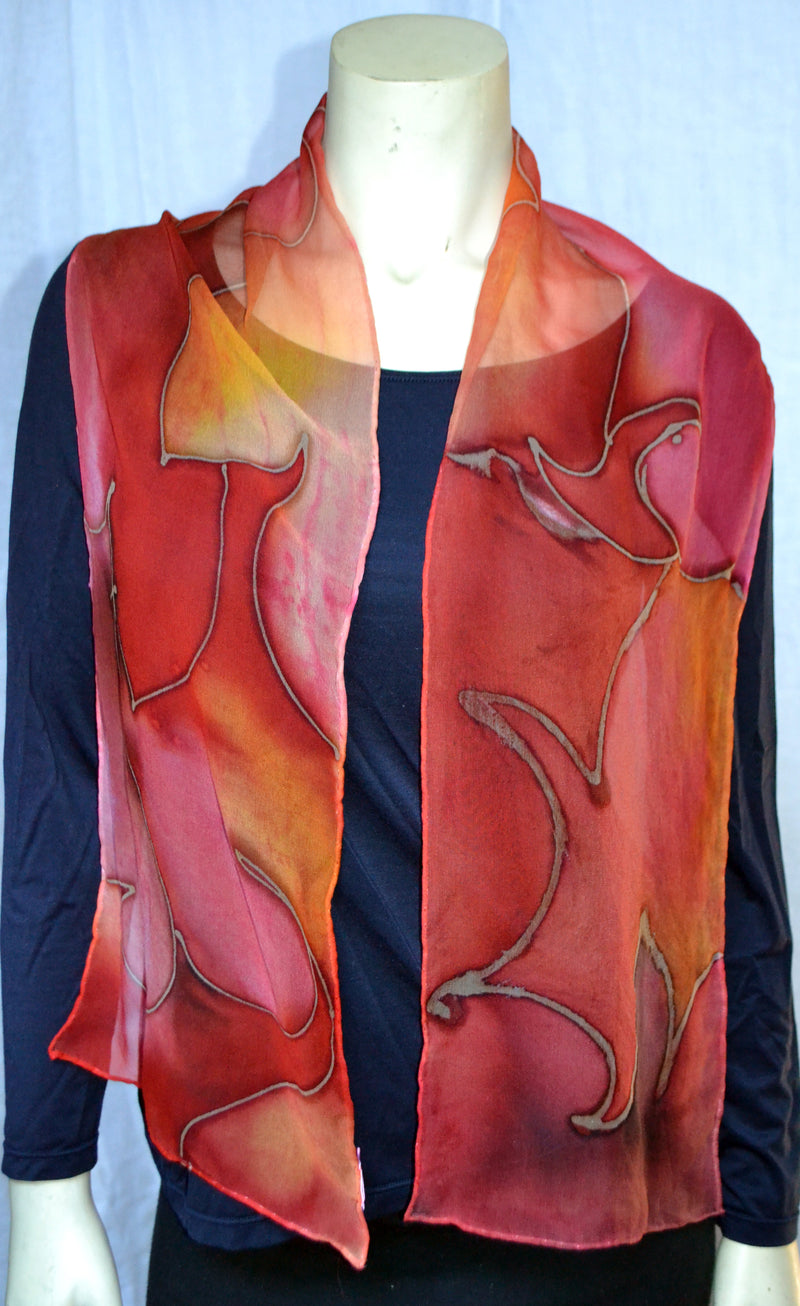Traditional Indian designs from East of India were painted on this scarf. The scarves are made with silk chiffon. The scarves in the picture are 12"/60". They are painted with gutta resist and silk dyes. After steaming for 14 hours, the dyes are permanent. They can be hand washed or dry cleaned.